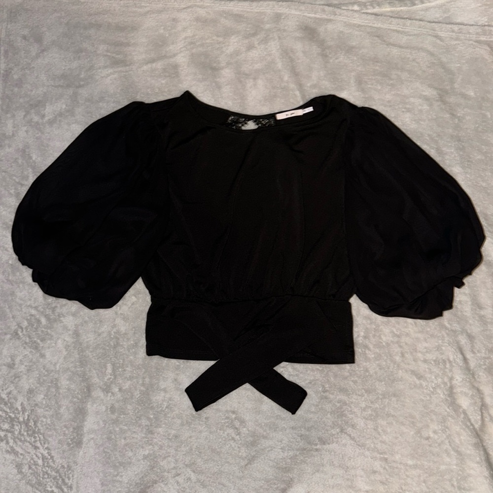 Dressier black top, with laced line back that ties